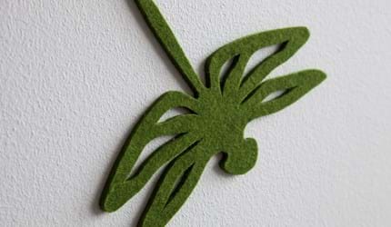 Fraster filt udskåret som guldsmed opklæbet på væg